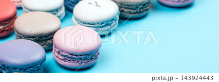 Macarons on blue with copy space for text Macarons on blue with copy space for text 143924443