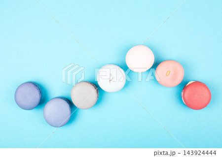 Group of pastel colorful macarons on trendy background Group of pastel colorful macarons on trendy background 143924444
