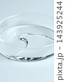 Testing a transparent cosmetic product in a Petri dish. 143925244