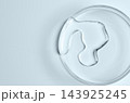 Testing a transparent cosmetic product in a Petri dish. 143925245