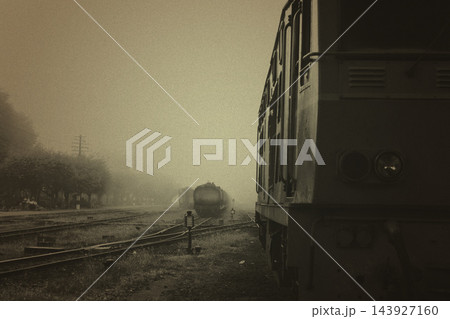 Vintage Train in Foggy Railway Yard with Sepia Cinematic Mood Vintage Train in Foggy Railway Yard with Sepia Cinematic Mood 143927160