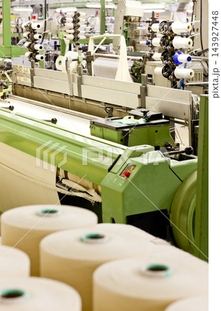 Textile Factory Loom Machine with Yarn Spools Textile Factory Loom Machine with Yarn Spools 143927448