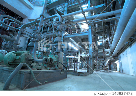 Industrial Plant Interior with Pipes, Valves, and Machinery Industrial Plant Interior with Pipes, Valves, and Machinery 143927478