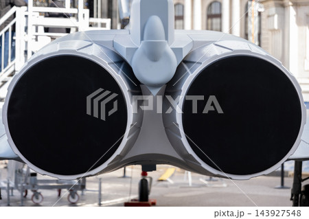 Rear view of twin jet engines on an aircraft display Rear view of twin jet engines on an aircraft display 143927548