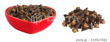 dry spice cloves in ceramic bowl isolated on white background. dry spice cloves in ceramic bowl isolated on white background. 143927882