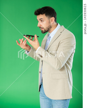 Man records voice message using voice recorder or communicates with voice messages Man records voice message using voice recorder or communicates with voice messages 143930615
