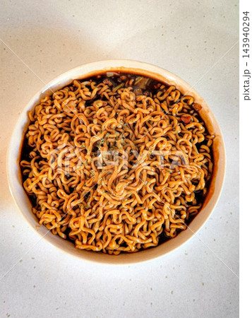 Savory jjapagetti with rich, black bean sauce and chewy noodles, paired with crispy, flavorful mandu. A delicious and satisfying Korean comfort food combination, perfect for any meal! Savory jjapagetti with rich, black bean sauce and chewy noodles, paired with crispy, flavorful mandu. A delicious and satisfying Korean comfort food combination, perfect for any meal! 143940294