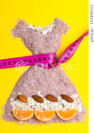 dress shape made from bran with measure tape 143946123