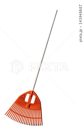 Orange plastic leaf rake isolated on white background 143948687