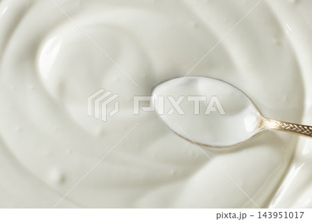 Culinary sour cream milky background. Spoon full of sour cream. Space for text. 143951017