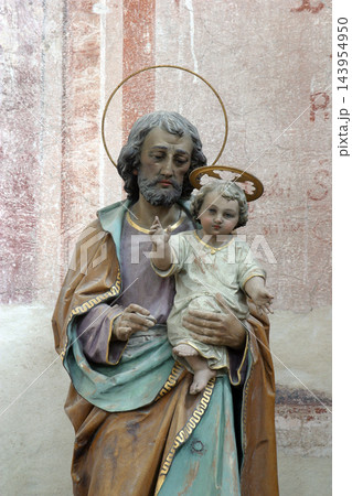 Saint Joseph holding baby Jesus statue on the altar in the parish Church of Saint Anthony of Padua in Bucica, Croatia Saint Joseph holding baby Jesus statue on the altar in the parish Church of Saint Anthony of Padua in Bucica, Croatia 143954950