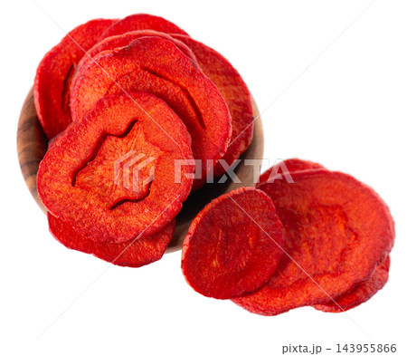 Crispy roasted carrot chips with sea salt, isolated on white background. Healthy and crunchy natural vegetable snack. Clipping path. Crispy roasted carrot chips with sea salt, isolated on white background. Healthy and crunchy natural vegetable snack. Clipping path. 143955866