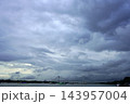 Dramatic dark monsoon clouds hovering over Vidyasagar Setu cable stayed bridge and Hooghly river in Kolkata 143957004