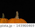 Pumpkins ready for Halloween decoration in a dark setting 143960469