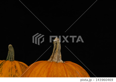 Pumpkins ready for Halloween decoration in a dark setting 143960469
