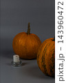 Pumpkins with a candle for Halloween celebration in autumn season 143960472