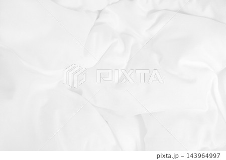 Close up top view of white bedding sheet and wrinkle messy blanket in bedroom after wake up in the morning. Close up top view of white bedding sheet and wrinkle messy blanket in bedroom after wake up in the morning. 143964997