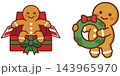Cute cartoon gingerbread man characters celebrating the christmas holiday season with a festive gift box and green wreath Cute cartoon gingerbread man characters celebrating the christmas holiday season with a festive gift box and green wreath 143965970