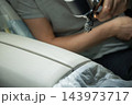 A technician uses an airbrush to dye the leather upholstery of a car. Detailing. 143973717