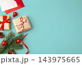 Christmas background with gift boxes and xmas ornament on blue background, top view 143975665
