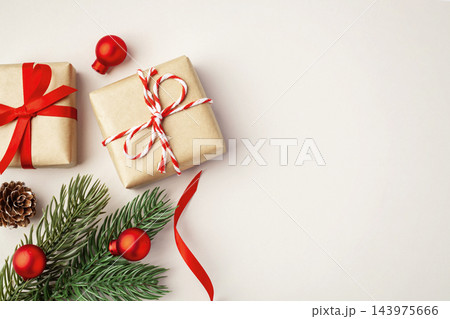 Gift boxes and christmas decorations on beige background, top view 143975666