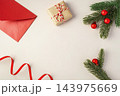 Christmas background, flat lay composition with gift box, red envelope, and pine branches 143975669