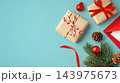 Gift boxes and christmas ornaments on blue background, copy space 143975673