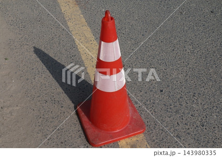 traffic cone on the road traffic cone on the road 143980335