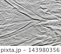 crumpled white linen texture background enhancing sustainable web design authentic branding overlay featuring deep organic fold raw minimalist fabric aesthetic evoking natural wellness 143980356