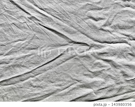 crumpled white linen texture background enhancing sustainable web design authentic branding overlay featuring deep organic fold raw minimalist fabric aesthetic evoking natural wellness 143980356