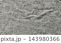 raw grey denim texture featuring deep woven fibers and soft fabric folds creating an authentic minimalist background for sustainable fashion branding and modern web design layouts 143980366