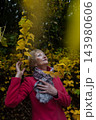 Happy senior woman in pink coat smiling outdoors in autumn park. Active elderly lifestyle, healthy aging and seasonal wellness concepts. Happy senior woman in pink coat smiling outdoors in autumn park. Active elderly lifestyle, healthy aging and seasonal wellness concepts. 143980606