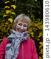 Happy senior woman in pink coat smiling outdoors in autumn park. Active elderly lifestyle, healthy aging and seasonal wellness concepts. Happy senior woman in pink coat smiling outdoors in autumn park. Active elderly lifestyle, healthy aging and seasonal wellness concepts. 143980610