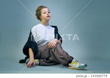 Studio portrait of a girl in casual clothing 143980779