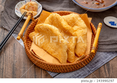 traditional Chinese Breakfast Fried Dough Blanket Youbing, Golden Crispy Flatbread Cruller traditional Chinese Breakfast Fried Dough Blanket Youbing, Golden Crispy Flatbread Cruller 143990297