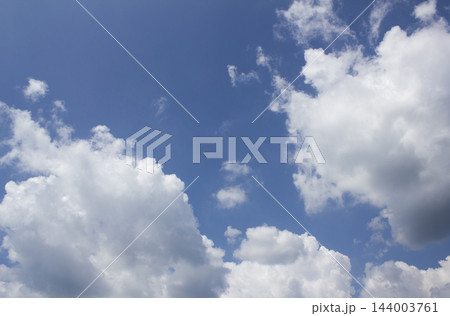 It is a blue sky with clouds. 144003761