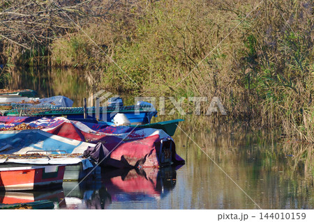 fishing boats moored in the stream fishing boats moored in the stream 144010159