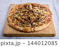 Homemade Pizza with Artichokes Olives Cheese and Herbs 144012085