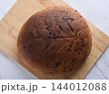 Round Homemade Rye Bread with Black Poppy Seeds 144012088