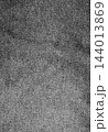 Wrinkled black denim fabric close up texture. 144013869