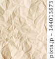 Crumpled beige paper texture background surface 144013873