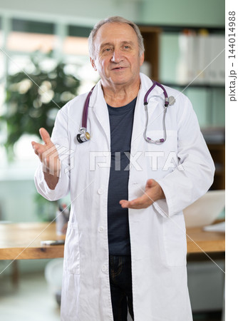 Senior man doctor speak in office conference hall. Senior man doctor speak in office conference hall. 144014988