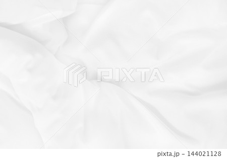 Close up top view of white bedding sheet and wrinkle messy blanket in bedroom after wake up in the morning. Close up top view of white bedding sheet and wrinkle messy blanket in bedroom after wake up in the morning. 144021128