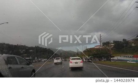Tropical Storm Clouds in Gray Sky Driving through the Island of Puerto Rico Tropical Storm Clouds in Gray Sky Driving through the Island of Puerto Rico 144028974