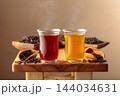 Black and green tea in small glass cups. 144034631