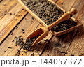 Green tea on an old wooden table. 144057372