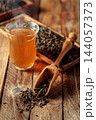 Green tea on an old wooden table. 144057373
