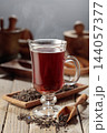 Black tea on a wooden table. 144057377