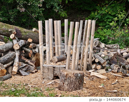 Traditional Woodwork at Countryside Cabin. Classic Farmstead Displaying Handcrafted Timber Activities Traditional Woodwork at Countryside Cabin. Classic Farmstead Displaying Handcrafted Timber Activities 144060674