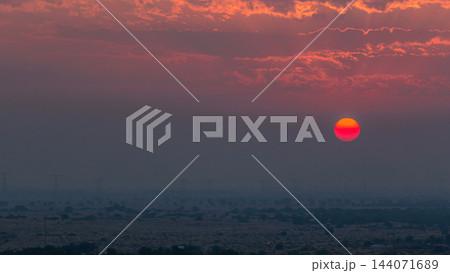 Sunset in Ajman aerial view from rooftop timelapse. United Arab Emirates. Sunset in Ajman aerial view from rooftop timelapse. United Arab Emirates. 144071689